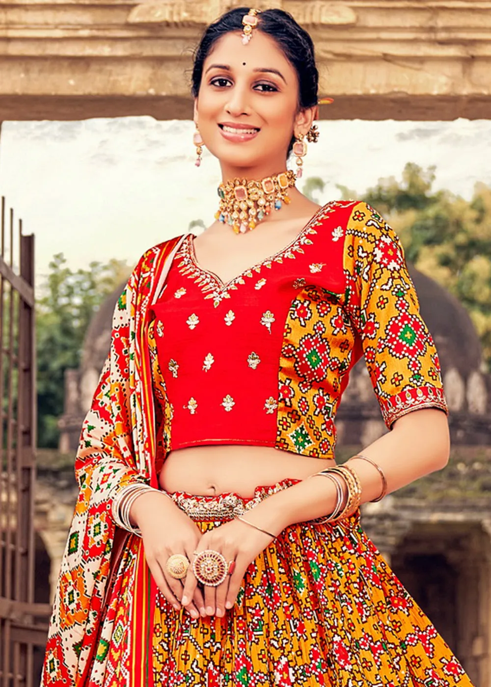 Orange & Red Patola Printed Banarasi Silk Lehenga Choli with Embroidery Work